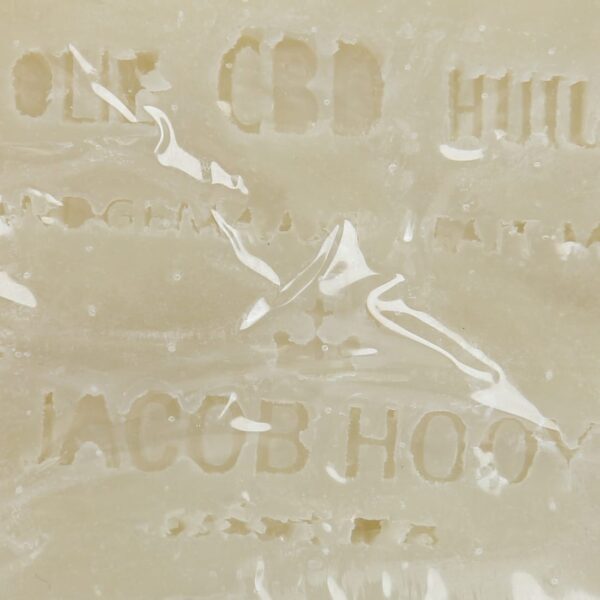 A close up of a Jacob Hooy CBD Soap with the word cbd on it.